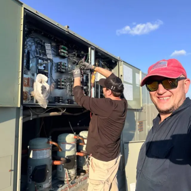 commercial HVAC Plano TX – TechBridge Pacific team repairing rooftop unit